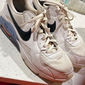 Nike White Sneakers with Black Swoosh and Blue Accent